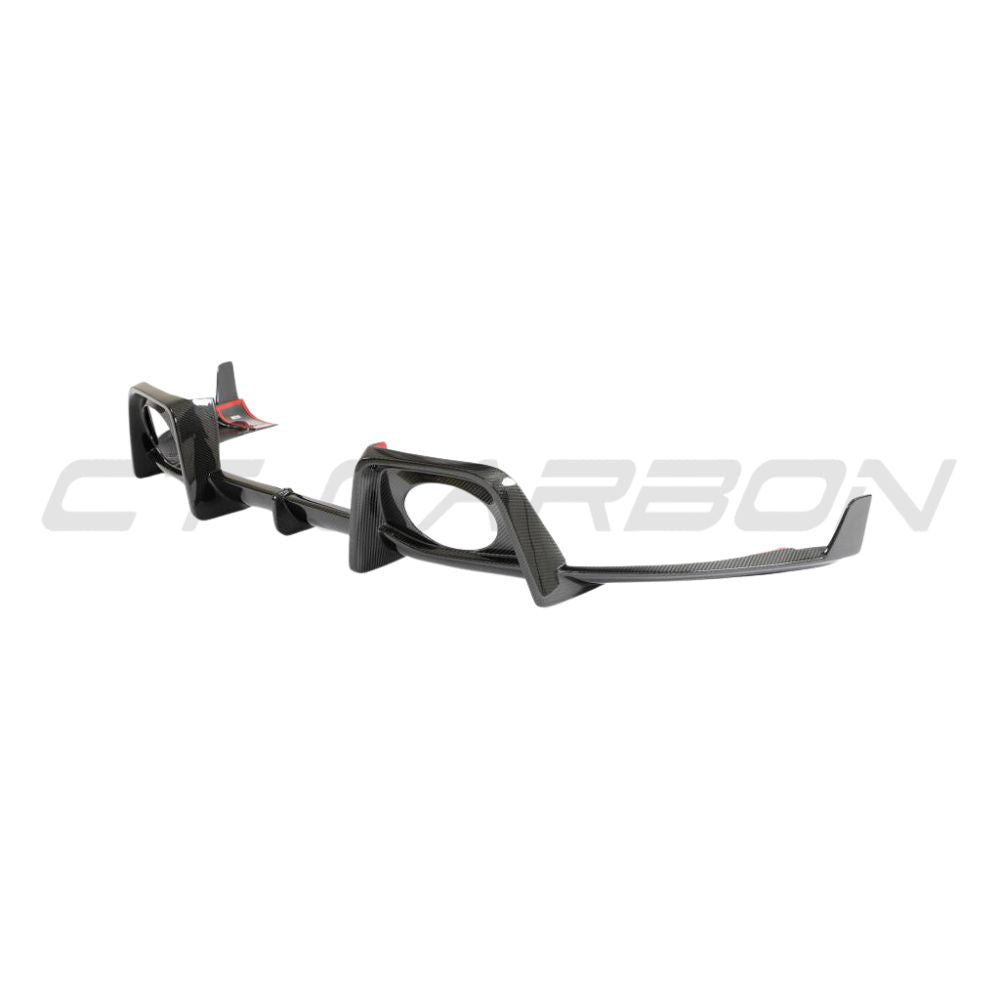 Porsche 911 992 Carrera carbon fibre diffuser by CT Design, showcasing sleek aerodynamic design and textured carbon fiber surface.