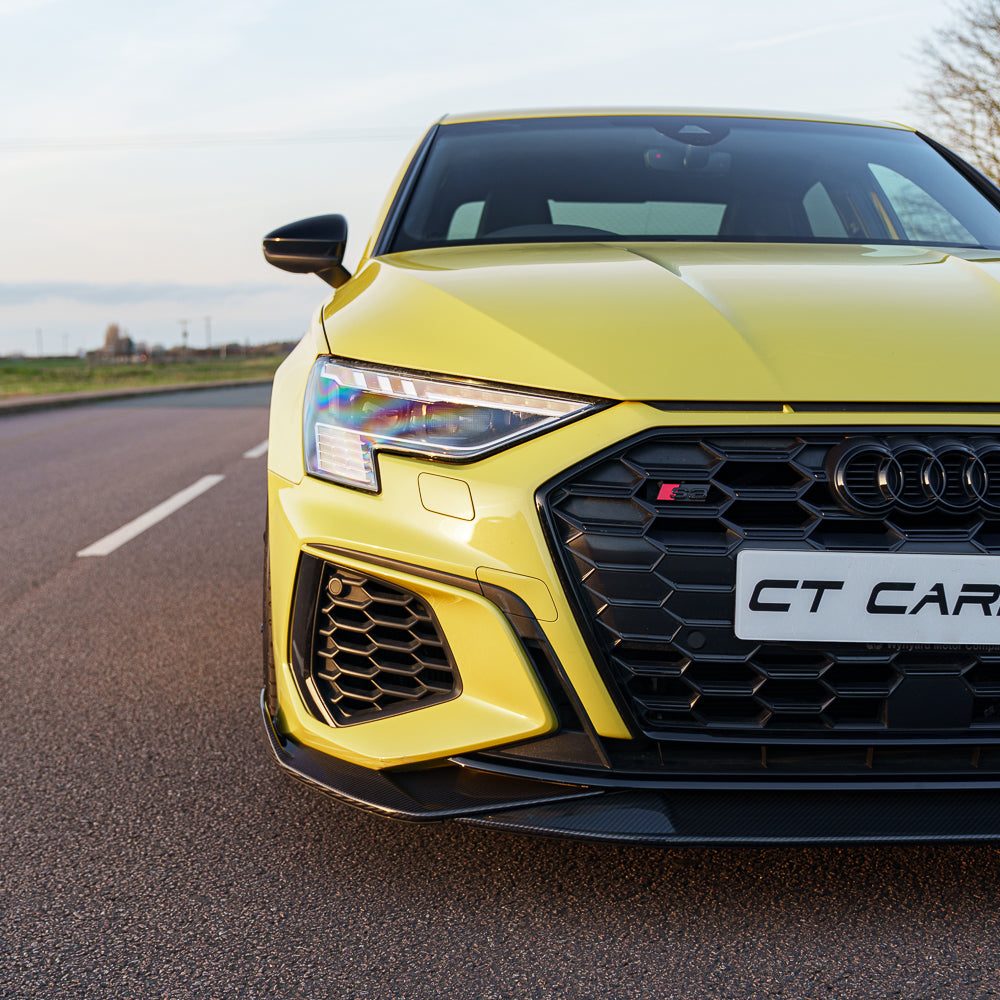Yellow Audi S3 8Y carbon fibre splitter by CT Carbon on a 2020+ A3 S-Line, showcasing the sporty front splitter design.