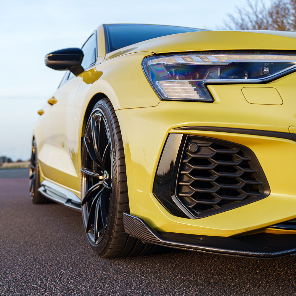 Yellow Audi S3 8Y carbon fibre splitter by CT Carbon, designed for Audi A3 S-Line and S3 2020+ models, showcasing sleek aerodynamic style.