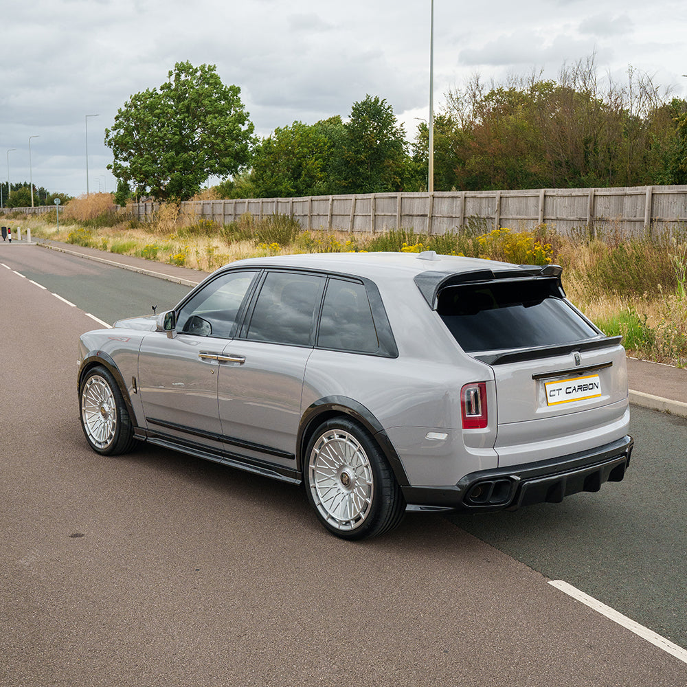 Rolls Royce Cullinan carbon fiber roof spoiler by CT Design, showcasing sleek, aerodynamic automotive accessory on a luxury vehicle.