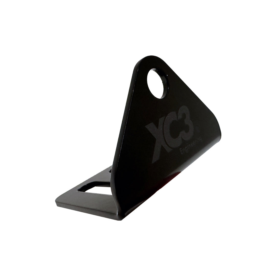 XC3 Engineering seat belt and harness mounting bracket for vehicle interior safety, shown in black metal with mounting points.