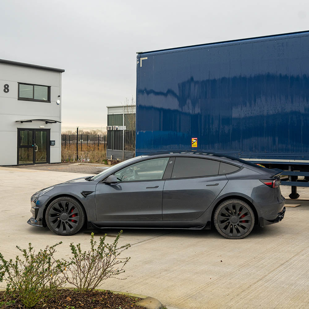 Tesla Model 3 full gloss black kit by CT Carbon, featuring sleek black exterior car accessories on a Tesla Model 3.