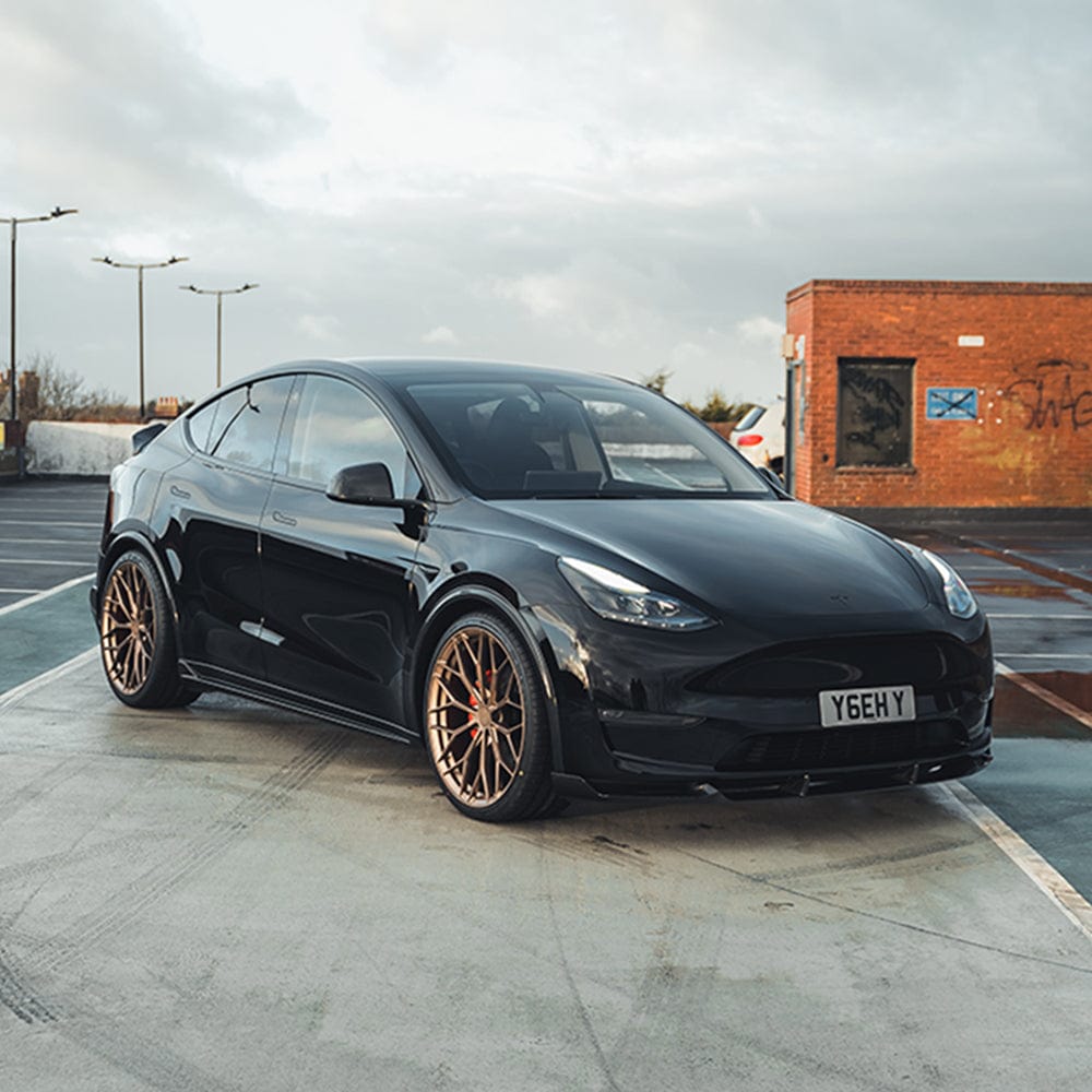 Tesla Model Y MK1 2020-2025 carbon fibre full kit by CT Carbon, showing the sleek carbon fibre components for the vehicle.