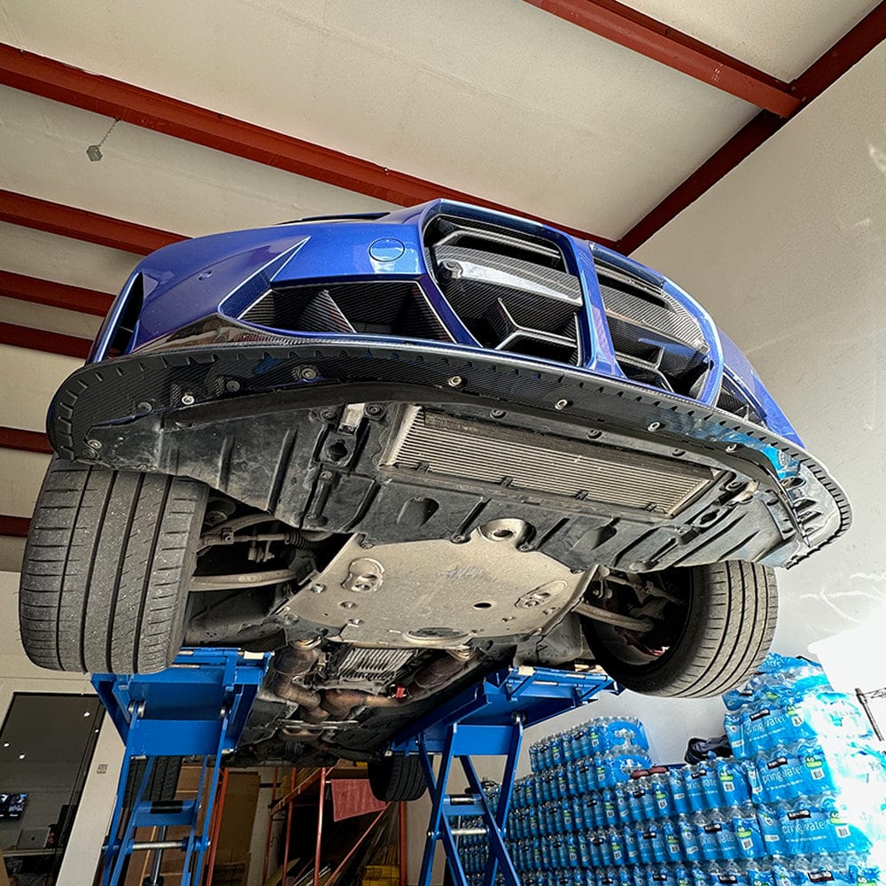 CT Carbon universal splitter lip protector installed on a vehicle's splitter for added protection and style.
