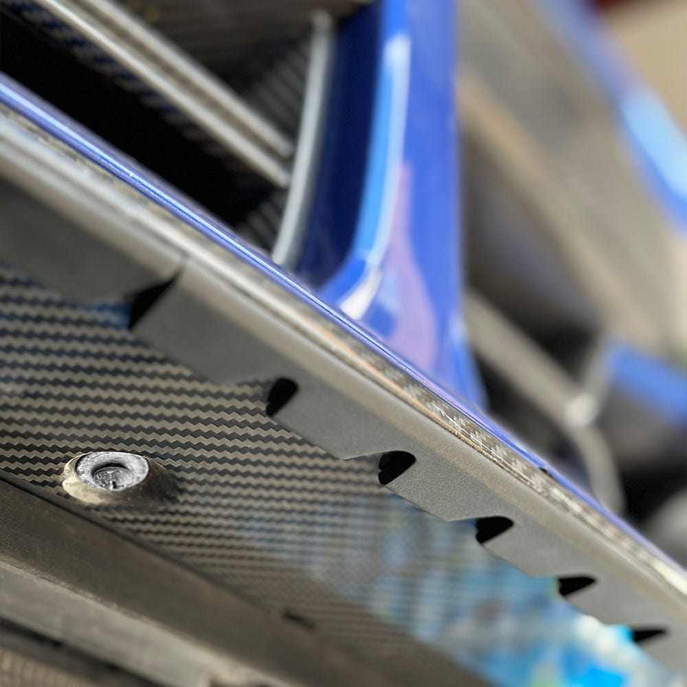Universal splitter lip protector by CT Carbon, a durable protective accessory for vehicle splitters, shown in black with textured surface.