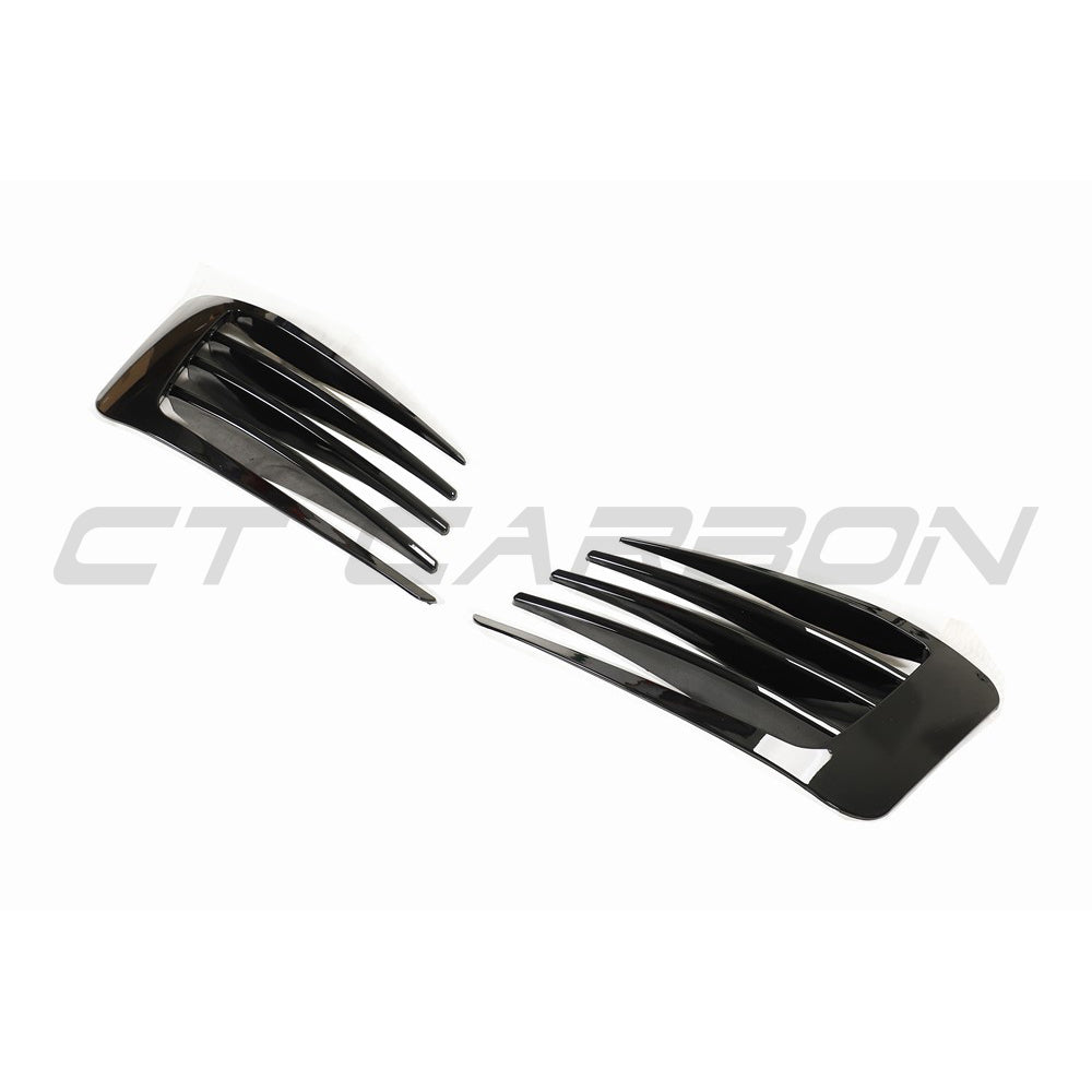 Volkswagen Golf MK7 GTI gloss black front bumper trim by CT Carbon, close-up view showing sleek automotive accessory details.