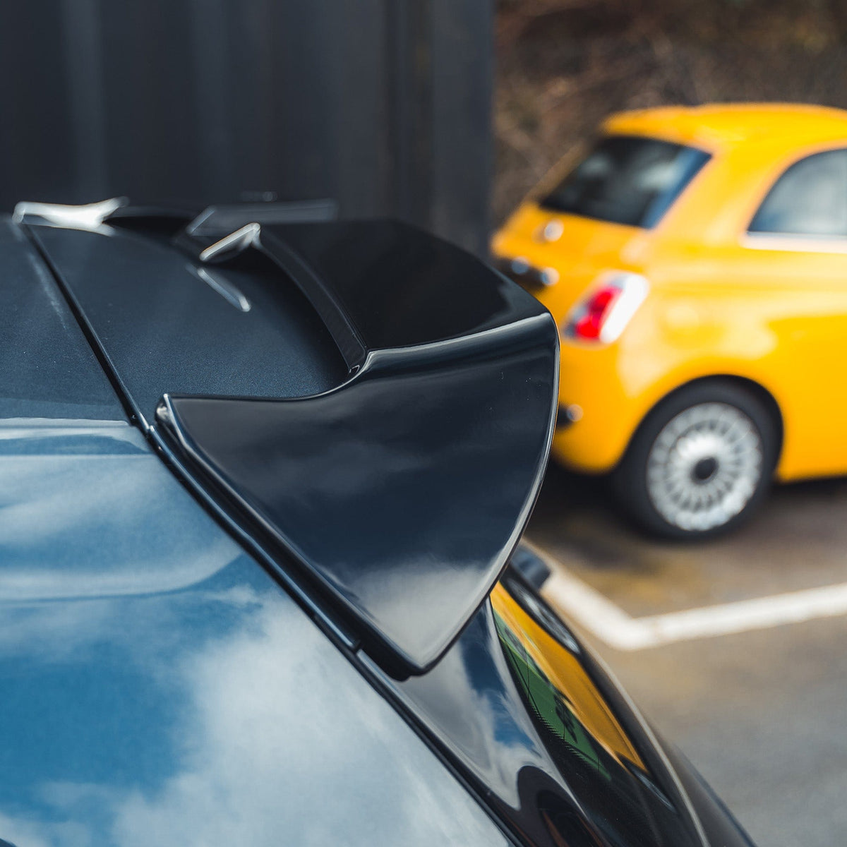 Gloss black spoiler for Volkswagen Golf R, GTD, GTI MK7/7.5 2014-2020 by CT Carbon, showing a sleek aerodynamic design.