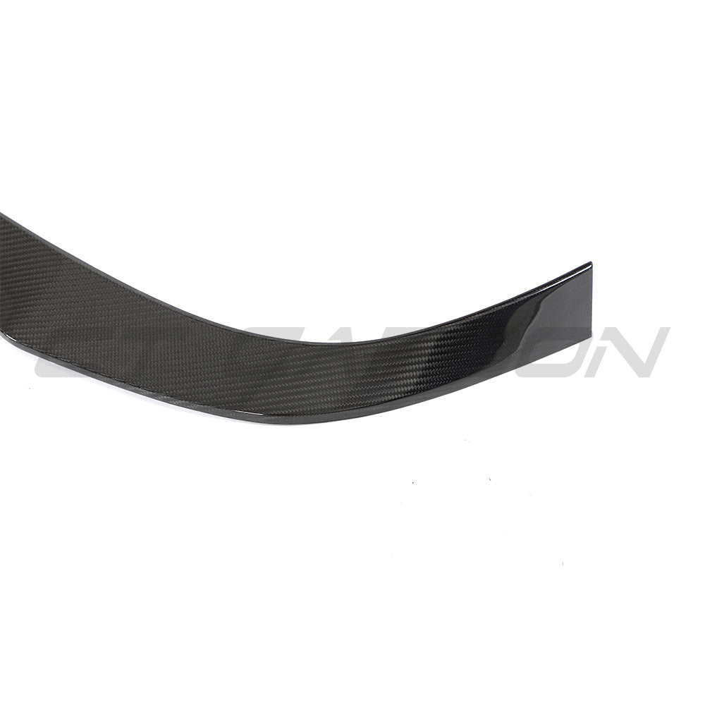 VW MK8 Golf R CS full carbon fibre kit by CT Design, featuring a sleek carbon fibre spoiler on a sporty hatchback.