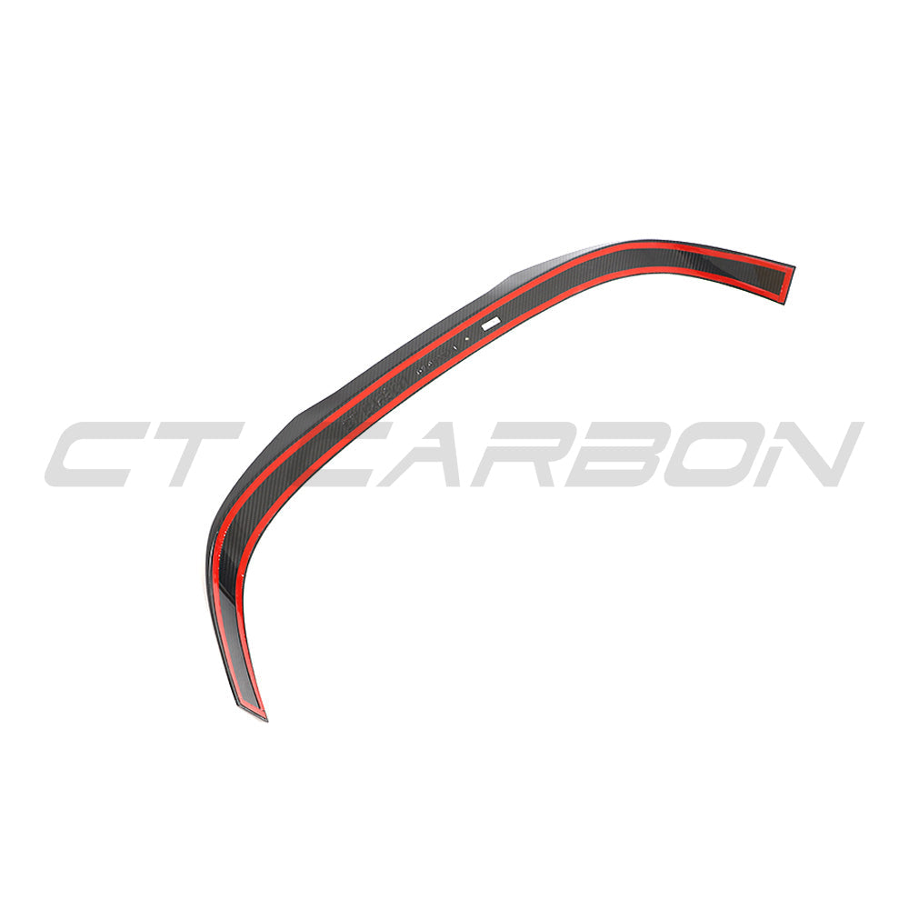 VW MK8 Golf R CS full carbon fiber kit by CT Design, featuring a sleek carbon fiber spoiler on a sporty hatchback.