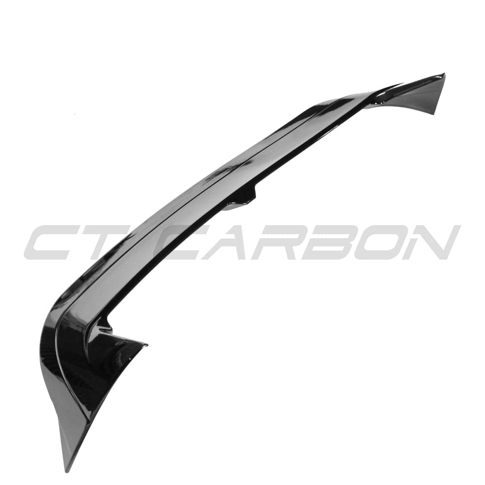 Gloss black VW Golf MK8 GTI/R 2020+ spoiler by CT Carbon, mounted on the car's rear for sporty aerodynamic enhancement.