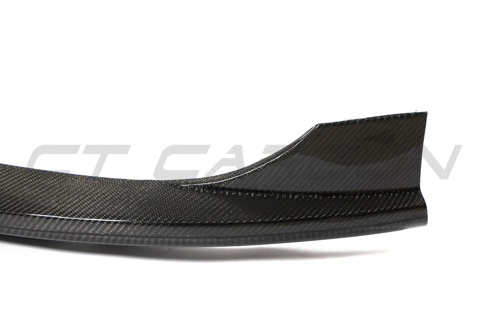 VW Golf MK8 GTI carbon fiber front splitter by CT Carbon, showcasing its aerodynamic design and sleek finish.