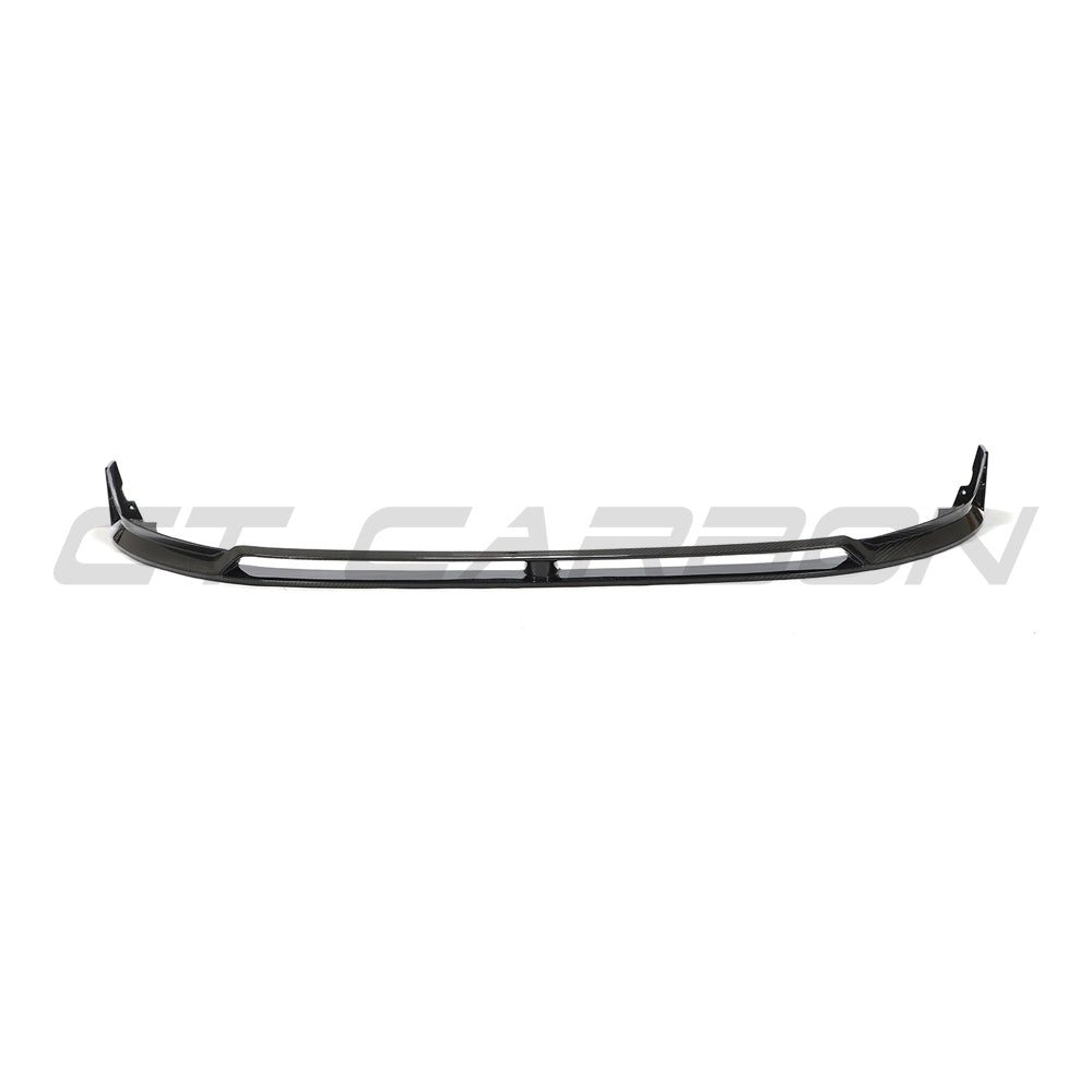 VW Golf MK8 GTI carbon fibre front splitter V2 by CT Carbon, showing the sleek aerodynamic design and textured carbon surface.