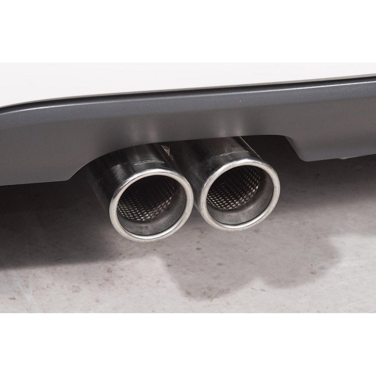 Cobra Sport VW Golf MK6 2.0 TDi cat back performance exhaust installed, showing dual exhaust tips and polished metal finish.