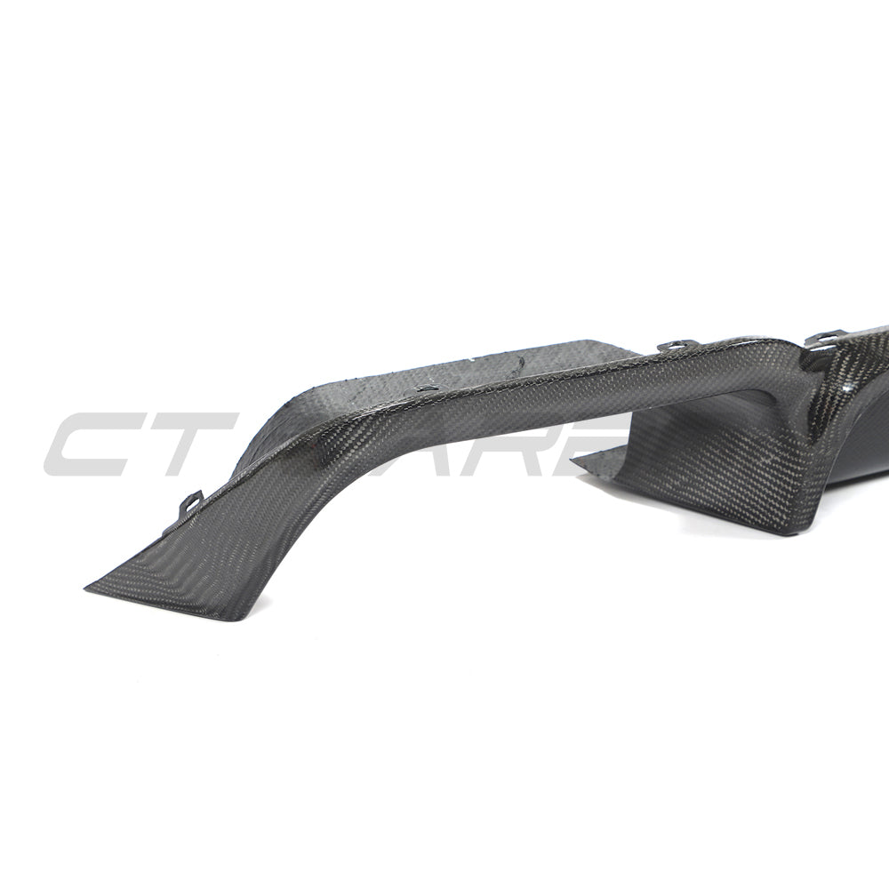 Carbon fiber diffuser for X3M F97 2018-2021 by CT Carbon, showcasing sleek black textured finish and aerodynamic design.