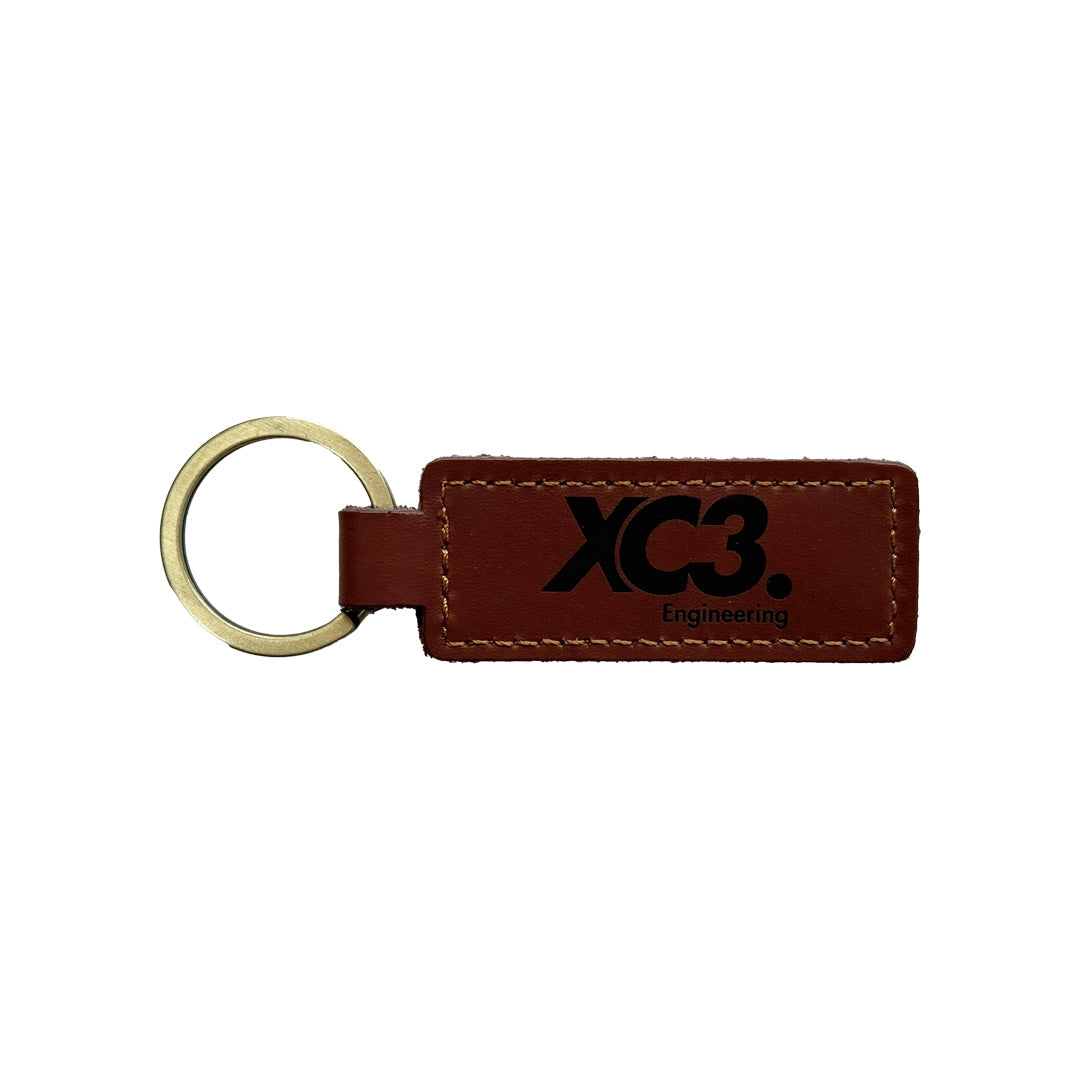 Leather keyring by XC3 Engineering in saddle brown, durable and stylish accessory for keys and everyday use.