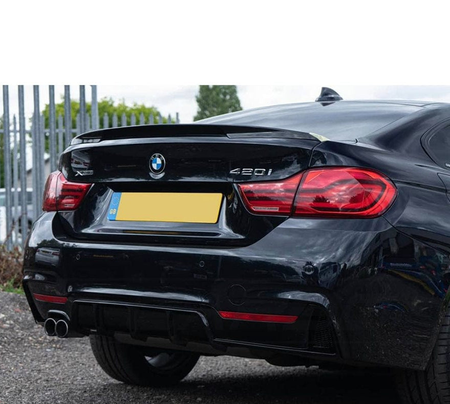 BMW 4 Series F32/F33/F36 GLOSS BLACK twin left exit exhaust diffuser by CT Carbon, showcasing sleek dual-exit design.