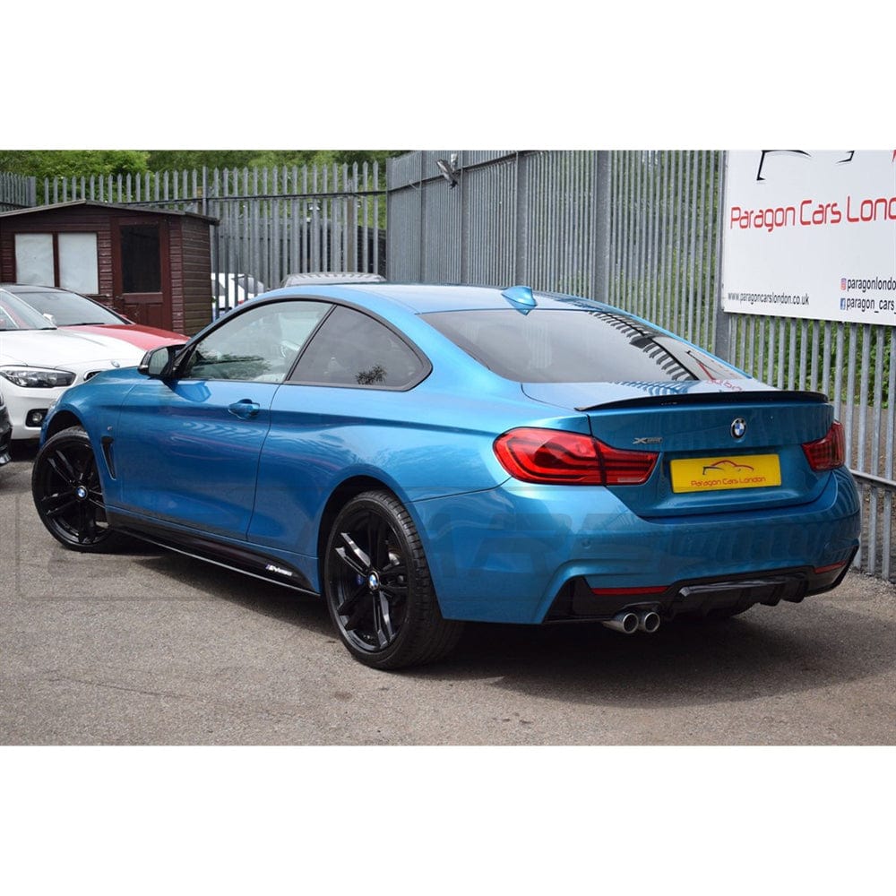BMW 4 Series F32/F33/F36 CT Carbon gloss black twin left exit exhaust diffuser, showcasing sleek dual exhaust design.