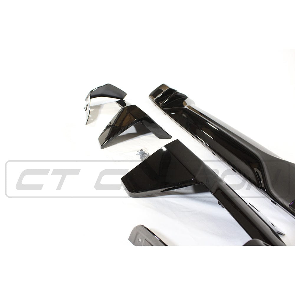 Black plastic kit for BMW G05 X5 MP Style by CT Carbon, showing full set of exterior trim pieces.