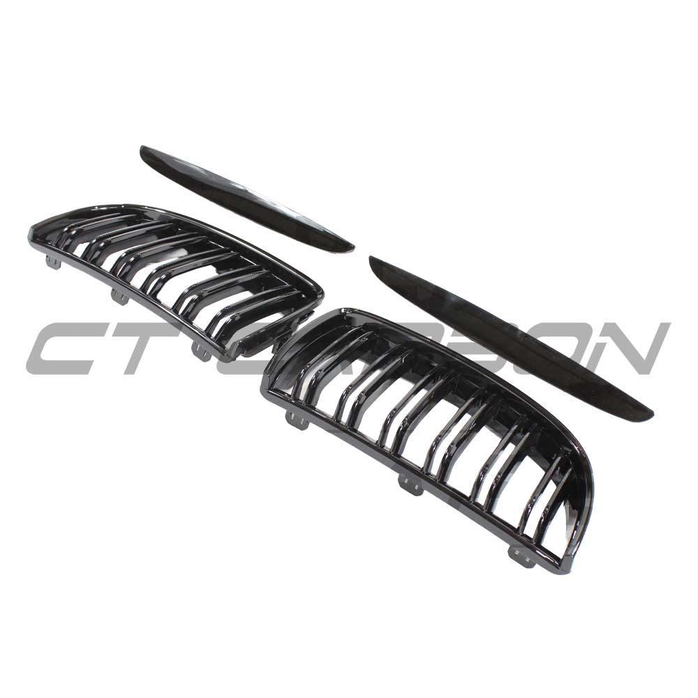 Black BMW E90 3 Series pre-LCI double slat grille by CT Carbon, close-up view showing sleek design and finish.