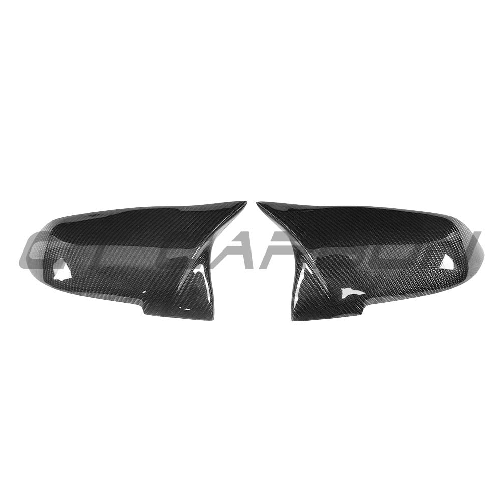 Black BMW F40 F44 1 & 2 Series carbon fiber mirror covers by CT Carbon, showcasing sleek, glossy exterior accessories.