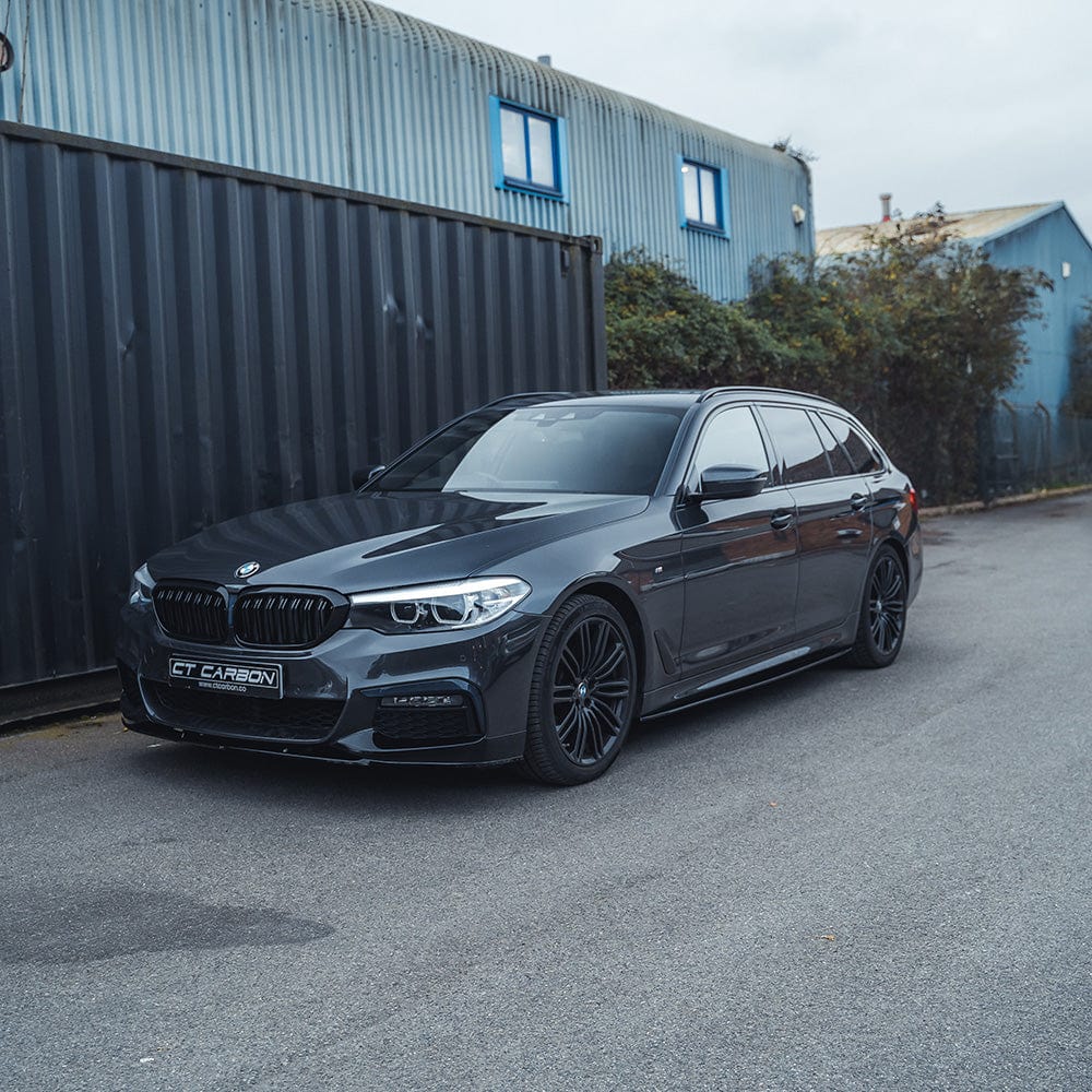 BMW 5 Series G30/31 side skirts in gloss black by CT Carbon, featuring a sleek MP style design for enhanced vehicle appearance.