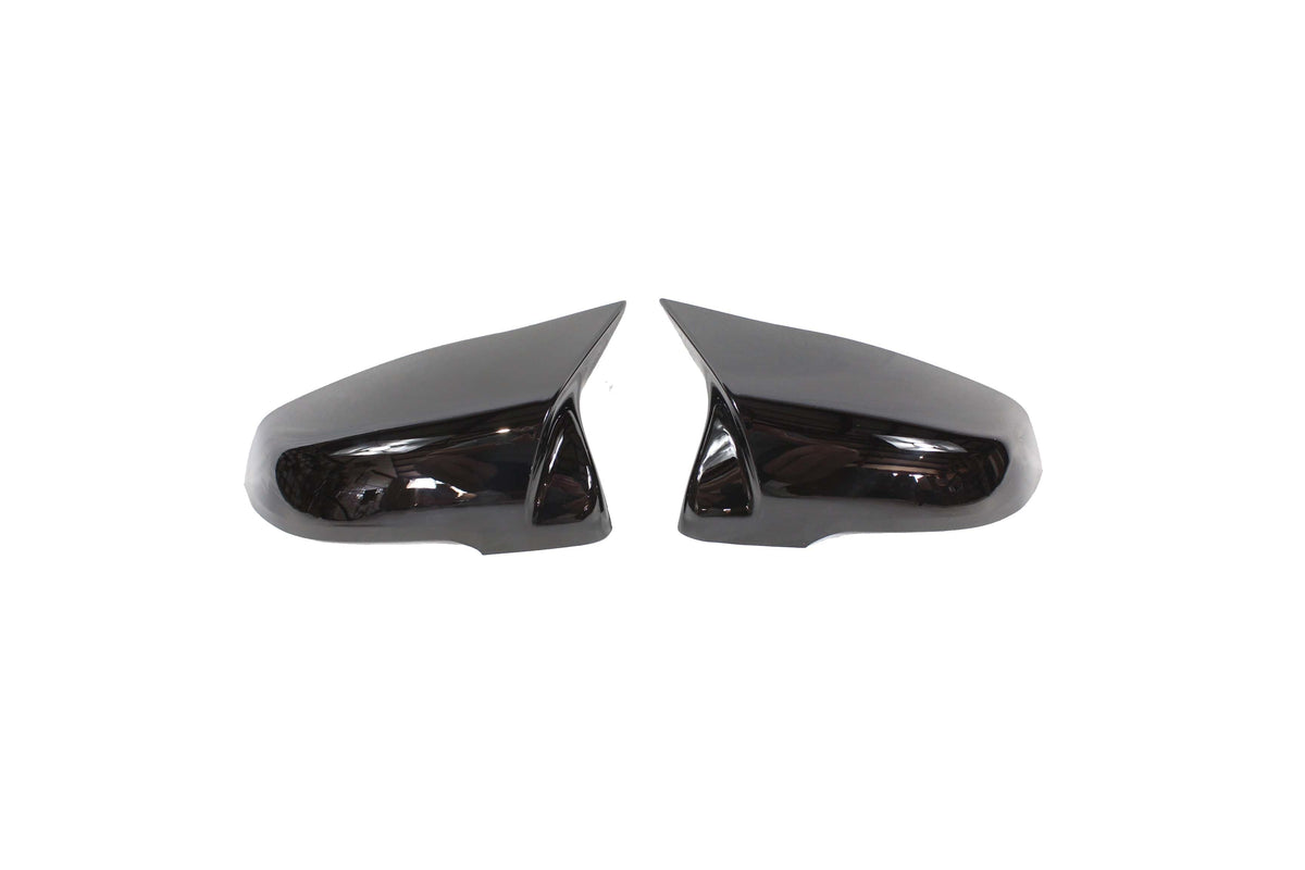 Gloss black replacement mirror covers for BMW F40 and F44 1 & 2 Series by CT Carbon, showcasing sleek exterior accessories.