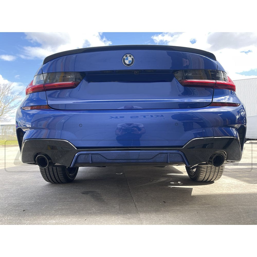 Black gloss spoiler for BMW 3 Series G20 and M3 G80 by CT Carbon, showcasing a sleek, aerodynamic design on the vehicle.