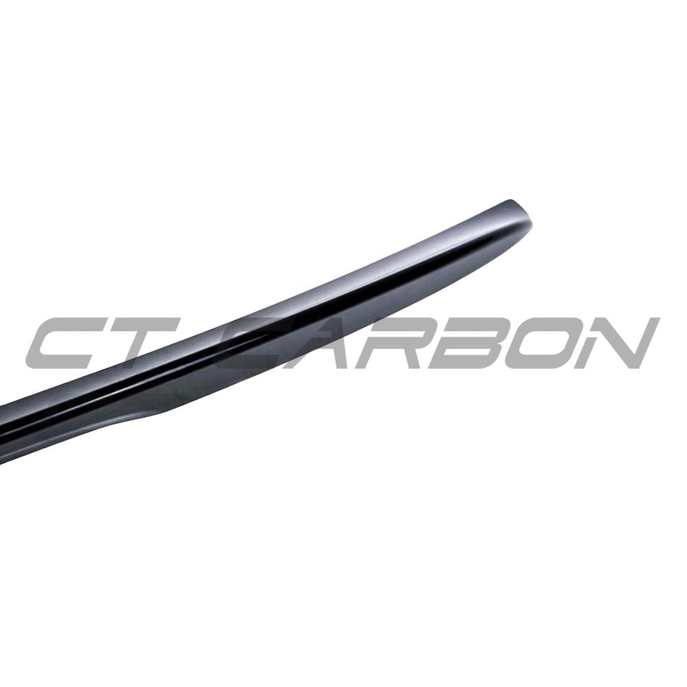 Gloss black BMW 4 Series F36 spoiler by CT Carbon, V2 style, mounted on the car, showcasing a sleek aerodynamic design.