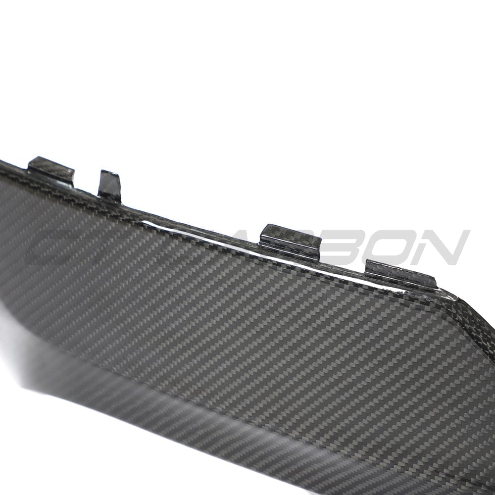 Black BMW G22 G23 4 Series carbon fiber diffuser by CT Carbon, showcasing sleek design and textured finish for sporty look.