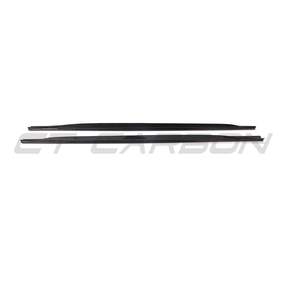Black carbon fibre side skirts and diffuser kit for BMW G22 4 Series from CT Carbon, featuring sleek, high-performance design elements.