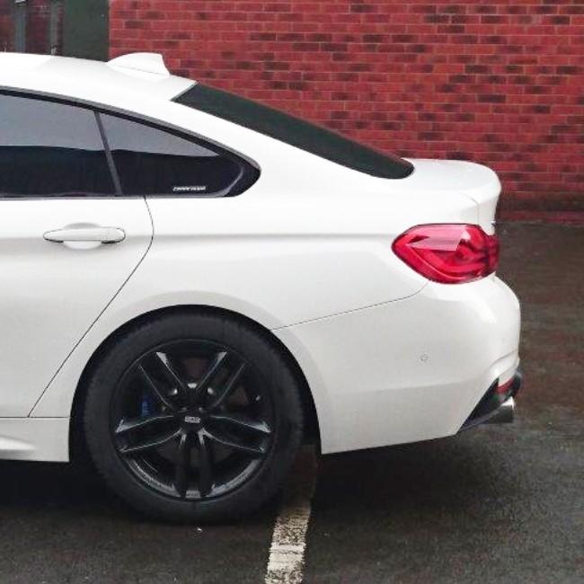 Cobra Sport BMW 435D F36 dual exit exhaust conversion showing polished chrome tips and exhaust pipe details.