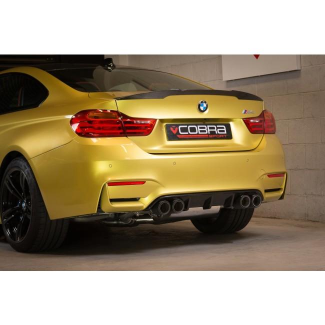Cobra Sport BMW M4 F82 coupe 3-inch valved primary cat back performance exhaust system installed, showing polished stainless steel pipes.