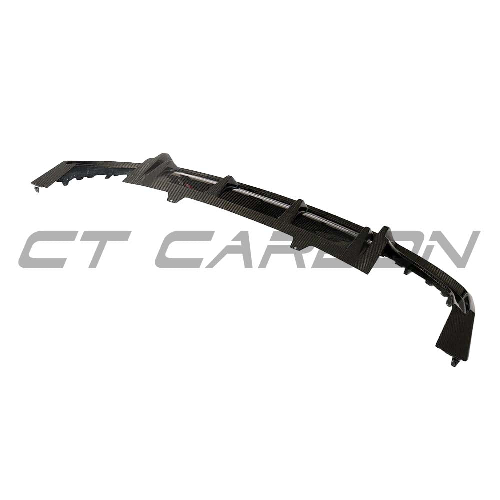 Carbon fiber diffuser for Audi A5 S5 B9 (2017-2021) by CT Carbon, showing sleek design and textured finish on the car's rear bumper.