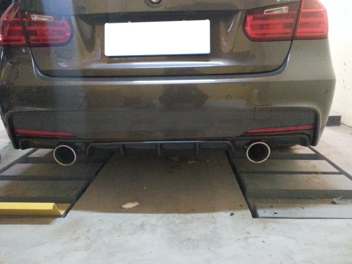 BMW F30/F31 3 Series carbon fiber diffuser by CT Carbon with dual exhaust cutouts, stylish V2 design.