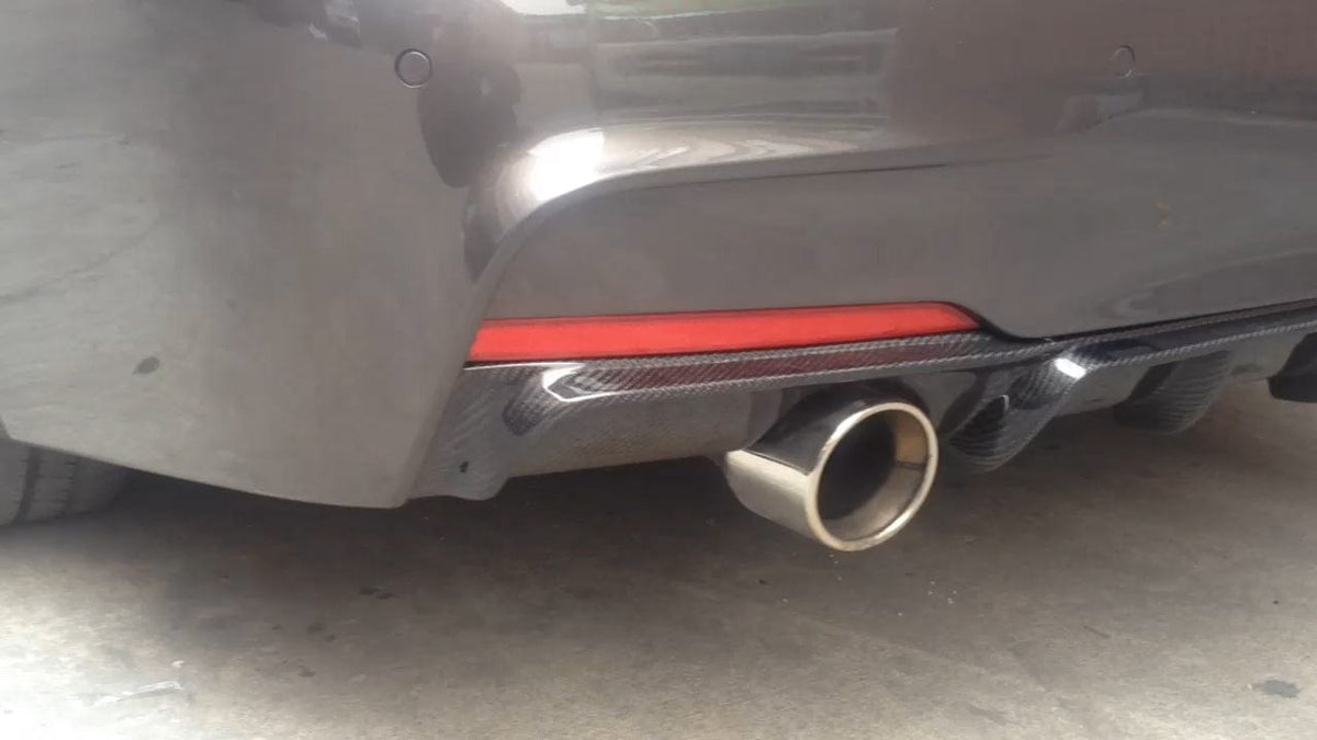 BMW F30/F31 3 Series carbon fibre diffuser by CT Carbon, V2 style with dual exhaust cutouts, installed on the rear bumper.
