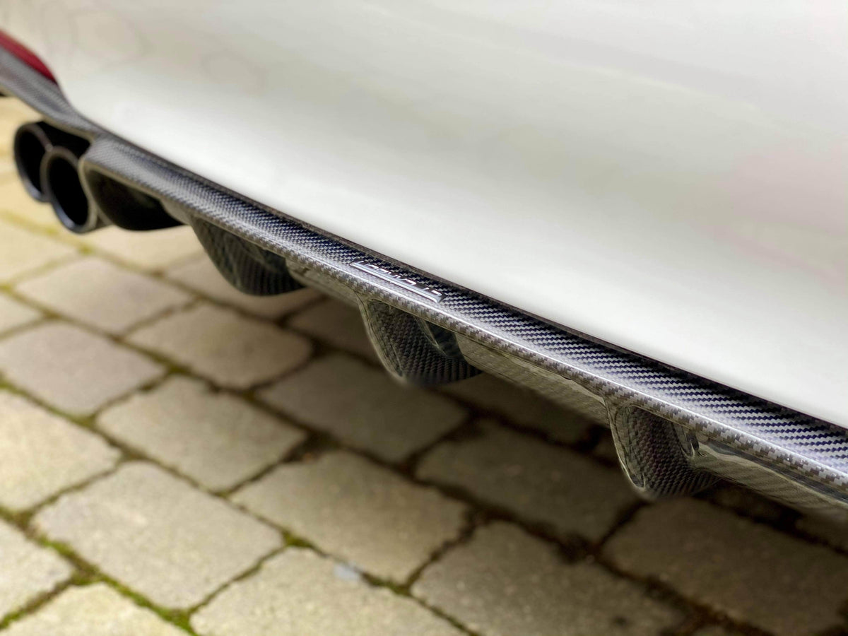 BMW F30/F31 3 Series carbon fibre diffuser with twin exhaust openings, designed by CT Carbon for a sleek, sporty look.