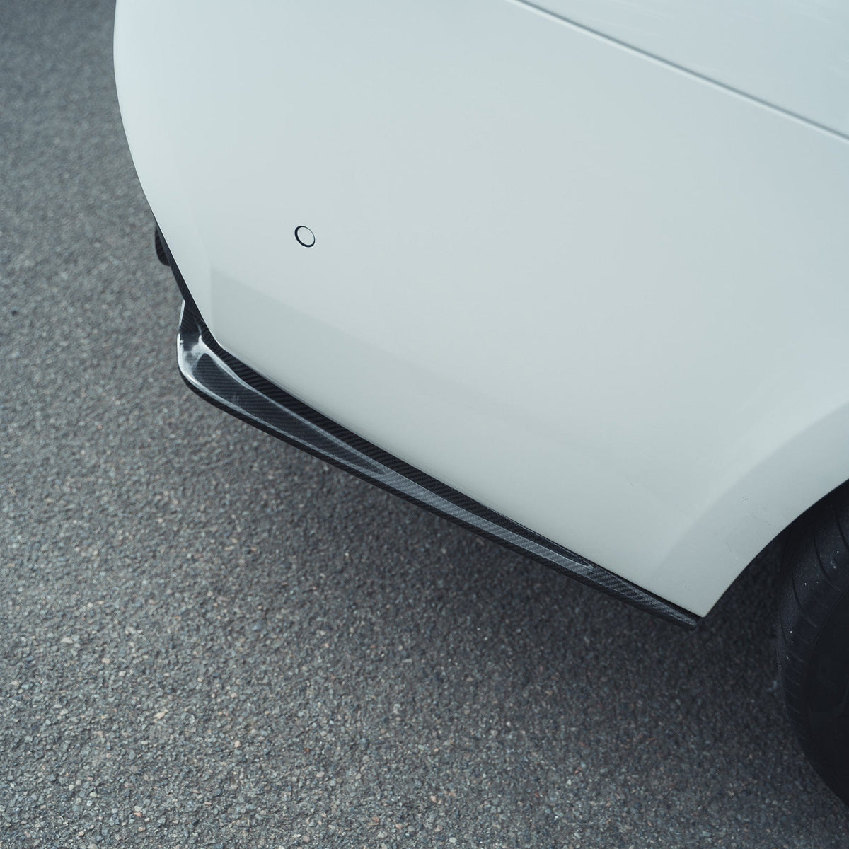 BMW F90 M5 CT Carbon V2 carbon fibre diffuser showcasing sleek, aerodynamic design and detailed craftsmanship.