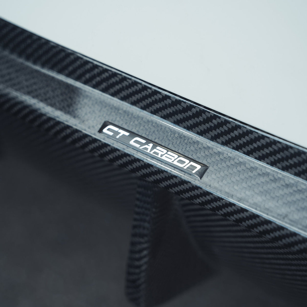 BMW F90 M5 CT Carbon fiber diffuser, V2, with a 3D style design, showcasing the sleek, aerodynamic carbon fiber finish.