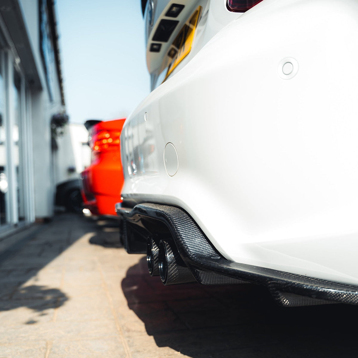 BMW M2 F87 carbon fibre diffuser by CT Carbon, K-style design, showcasing the sleek, aerodynamic rear diffuser in black carbon fiber.