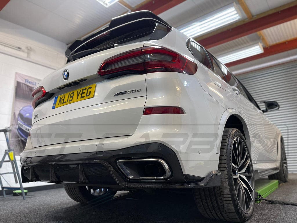 BMW X5 G05 2018-2023 CT Carbon fiber diffuser, front view showing sleek carbon fibre finish and aerodynamic design details.