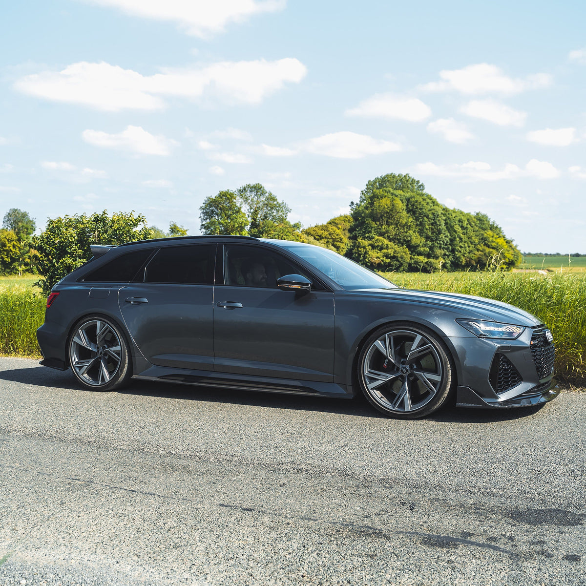 Carbon fibre side skirts for Audi RS6/RS7 C8 Avant 2019+ by CT Carbon, showcasing sleek, textured automotive side styling.