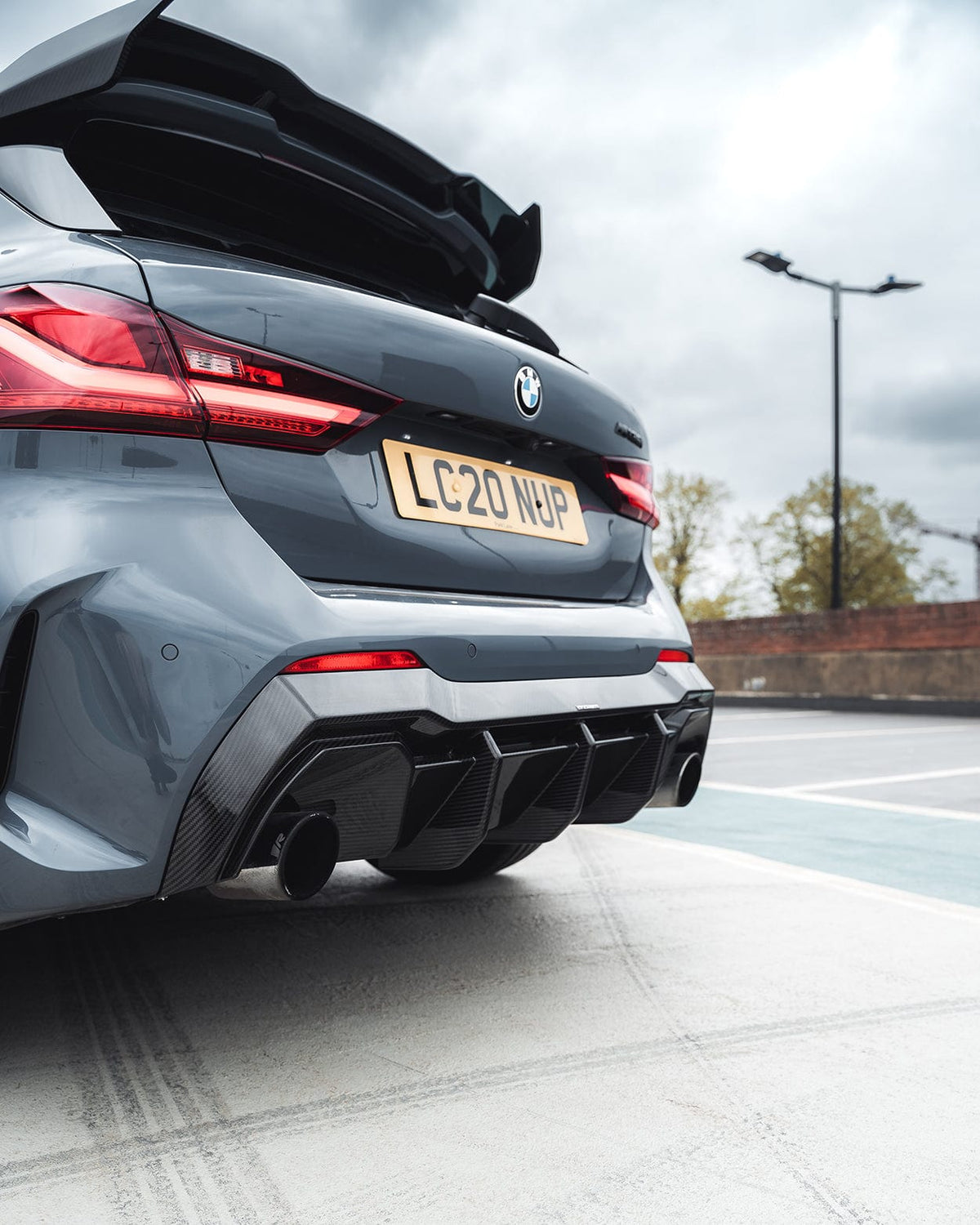 BMW 1 Series F40 2019-2024 CT Design full carbon fiber kit, including front and rear accents, for a sleek, sporty look.