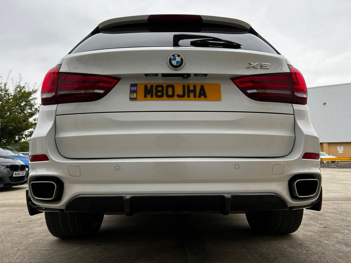BMW F15 X5 full carbon fibre kit by CT Carbon, including body panels and accessories, showcasing sleek, lightweight carbon fibre material.