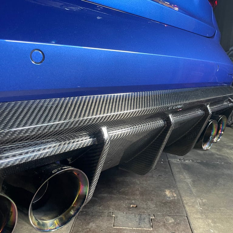 Full BMW G82 M4 carbon fibre kit by CT Carbon, including front and rear panels, showcasing sleek, lightweight carbon fibre components.