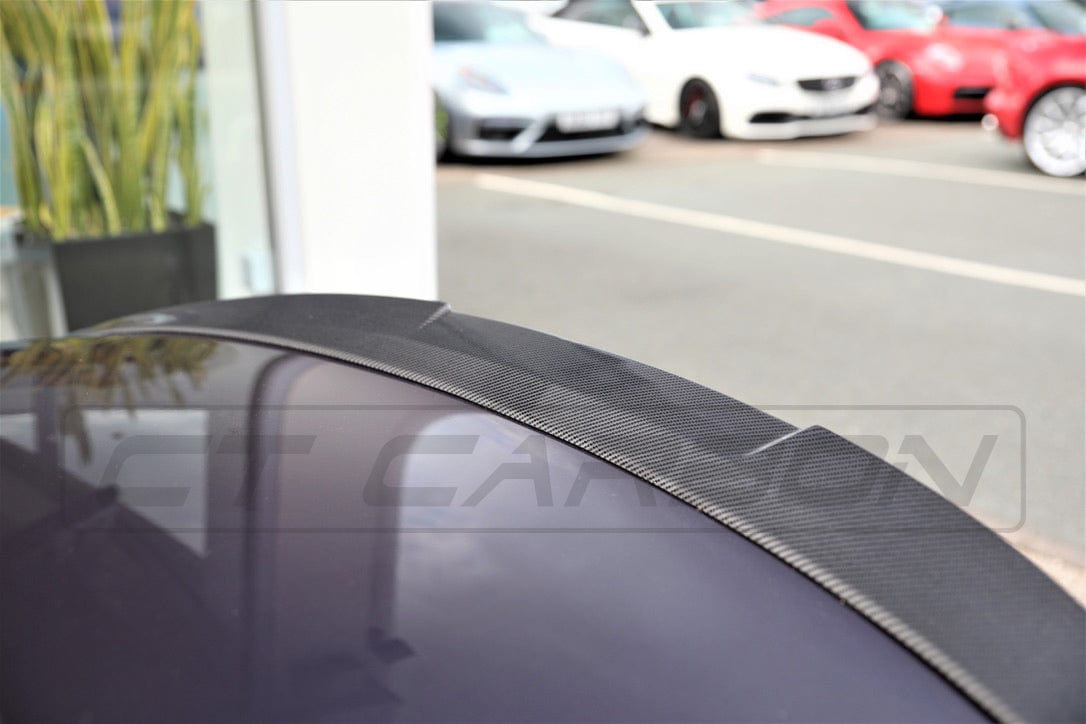 Full BMW M4 F83 convertible carbon fibre kit by CT Carbon, featuring V6 lightweight, aerodynamic components on a sleek car.