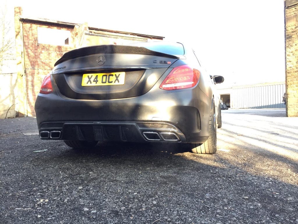 Full carbon fibre kit for Mercedes C63 W205 saloon by CT Carbon, including body panels in DTM style with visible weave pattern.