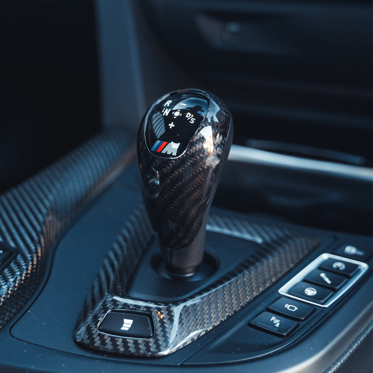 BMW Fxx M Car DCT shifter and surround set by CT Carbon, LHD interior accessories with carbon fiber finish.