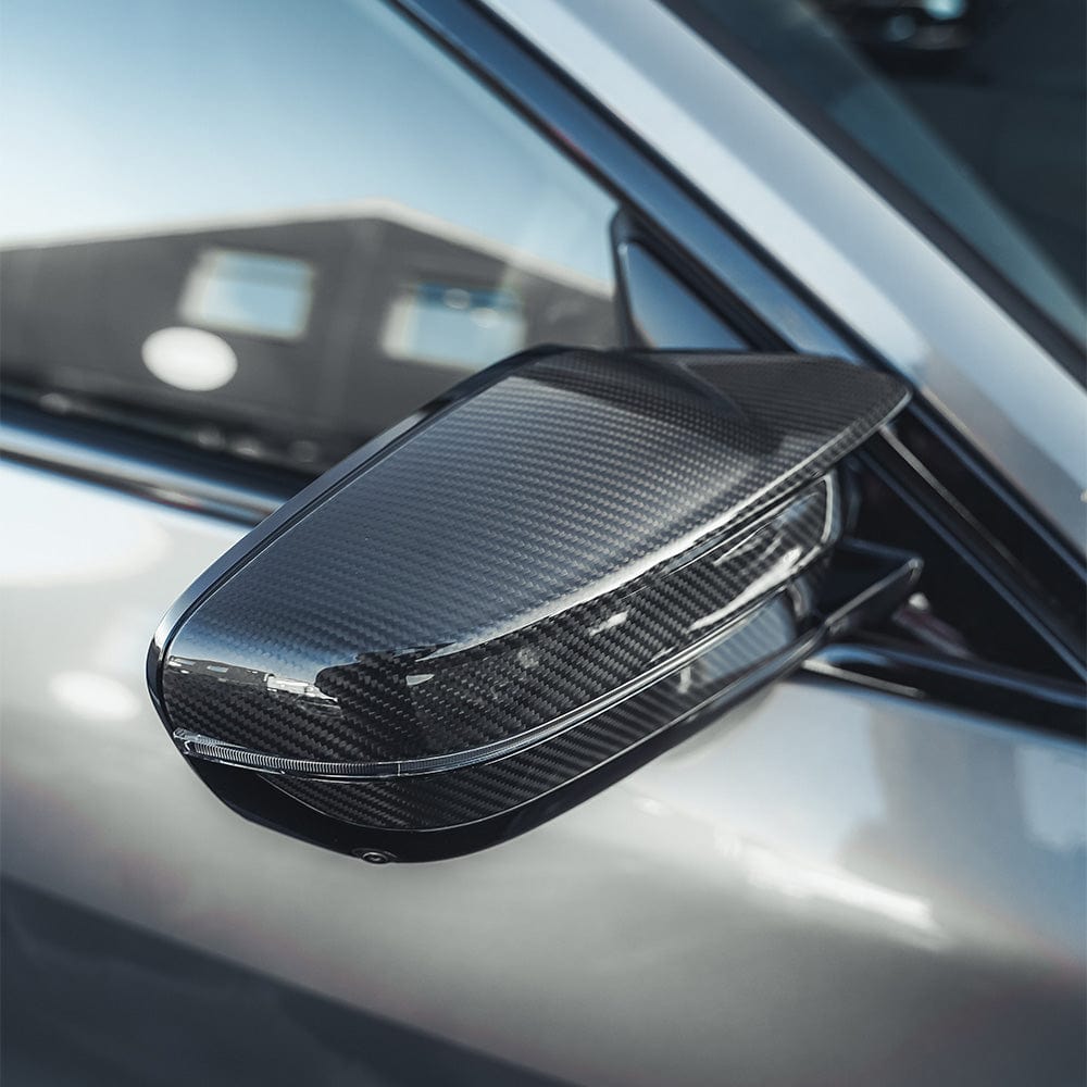 BMW M2 M3 M4 G80 G82 G83 G87 carbon fiber replacement mirrors for LHD models by CT Carbon, showing sleek reflective surfaces and aerodynamic design.