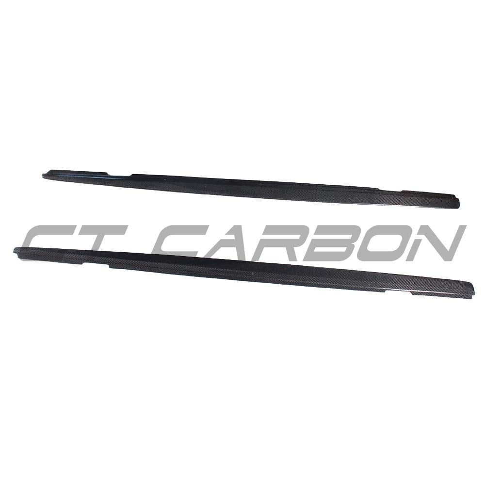 BMW 1 and 2 Series F20, F22, F23 carbon fibre side skirts by CT Carbon, installed on the vehicle's side for a sporty look.