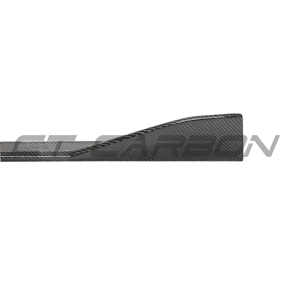 Carbon fibre side skirts for Toyota Supra A90 2019+ from CT Carbon, installed along the sides of the car.